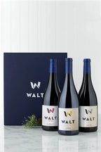 Image of WALT Appellation Trip Holiday gift set containing 3 bottles of WALT Pinot Noir and a blue WALT branded gift box.